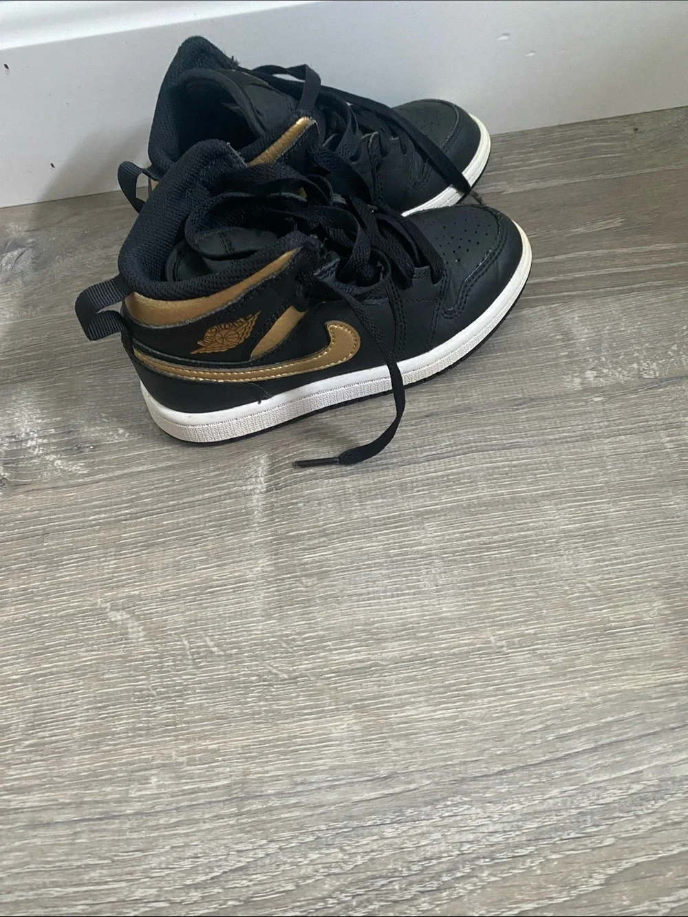 Jordan Kids Black and Gold High-Top Sneakers